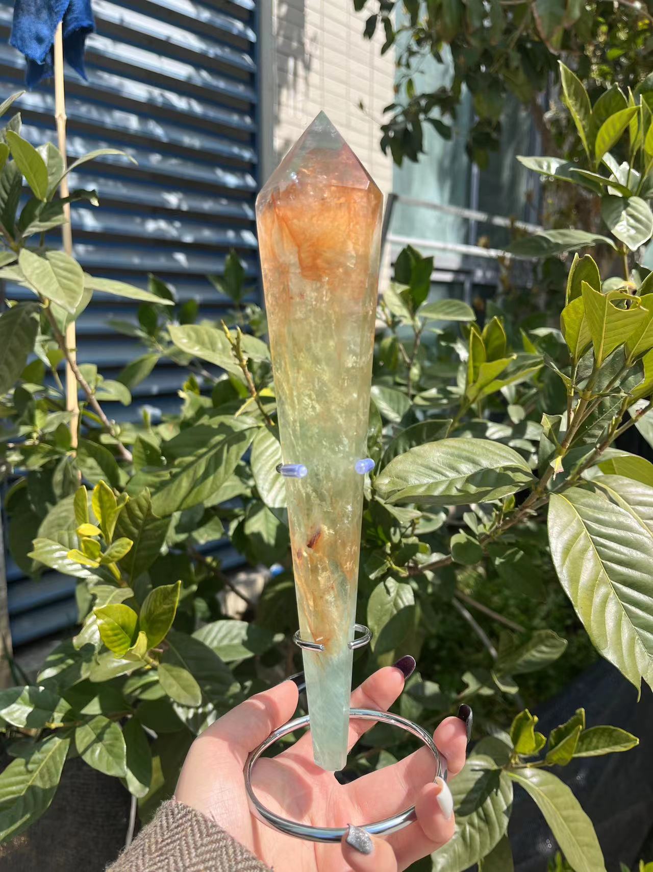 green fluorite with fire quartz wand